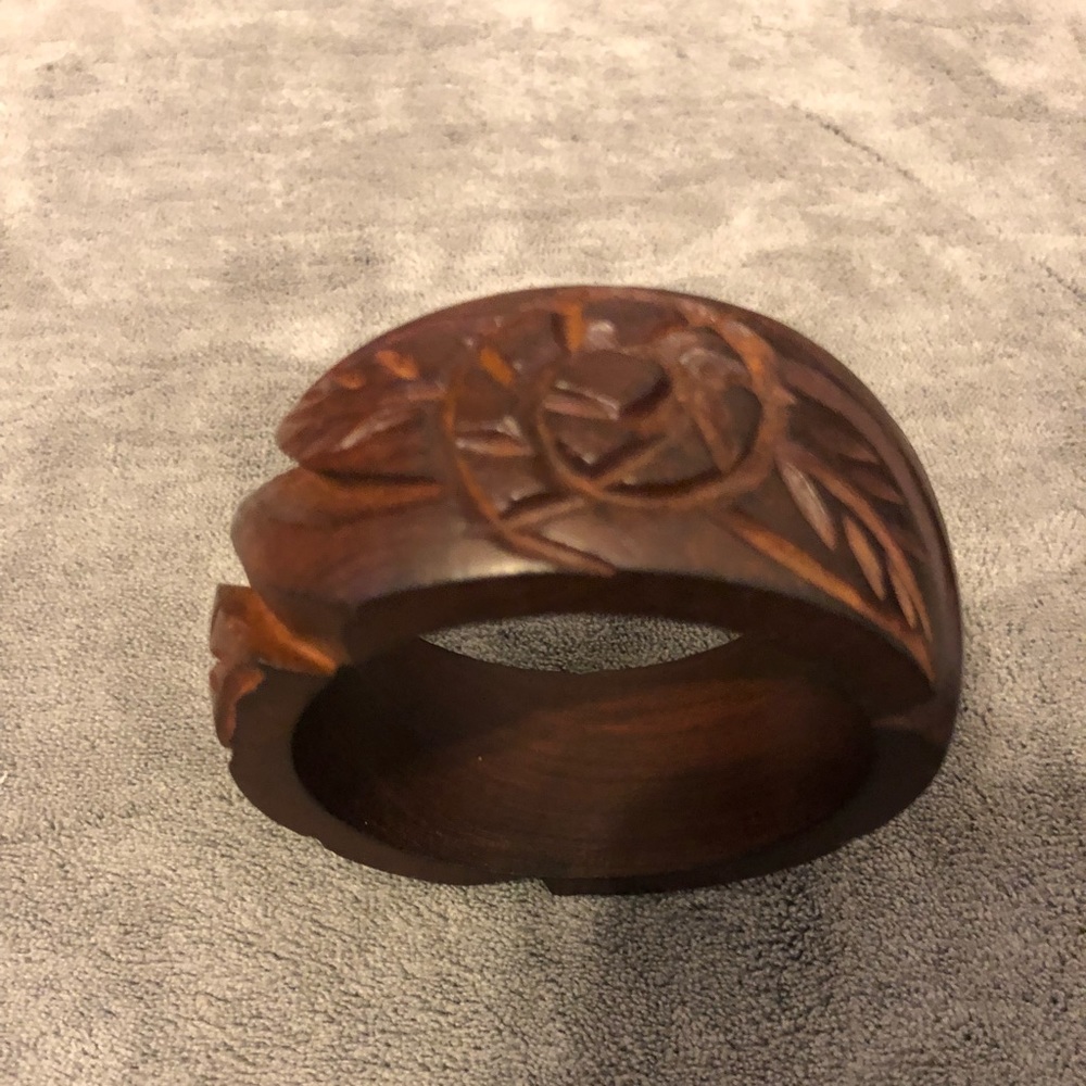 Beautiful wooden bracelet with carved flowers.